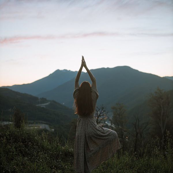 Silhouette of a person stretching, illustrating flexibility.